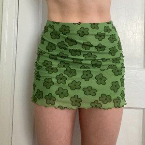 green mini skirt